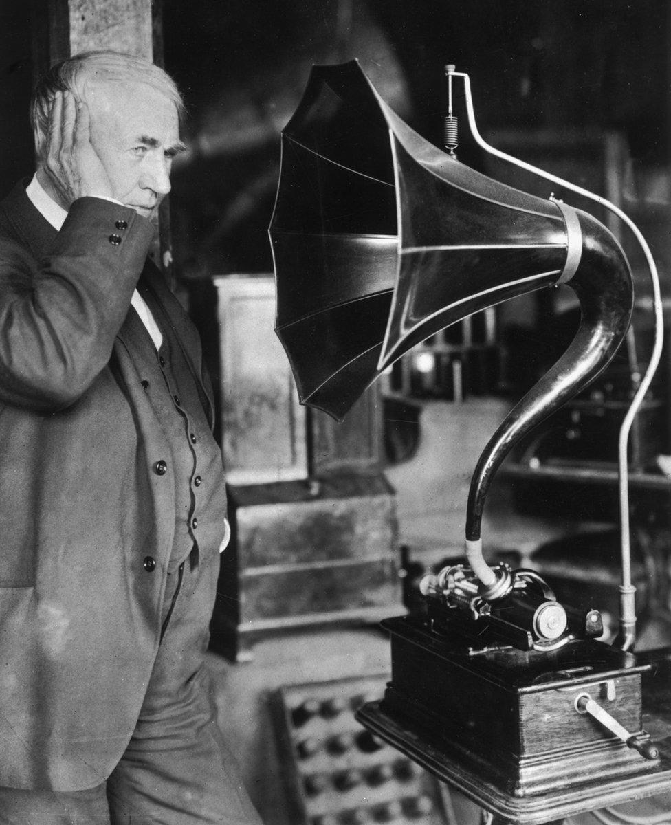 Thomas Edison listening to his phonograph