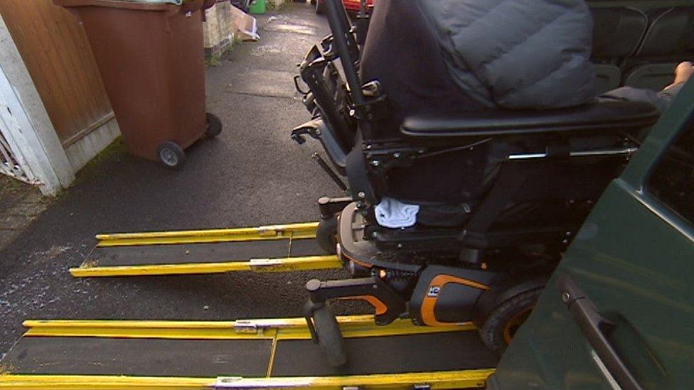 Wheelchair in taxi