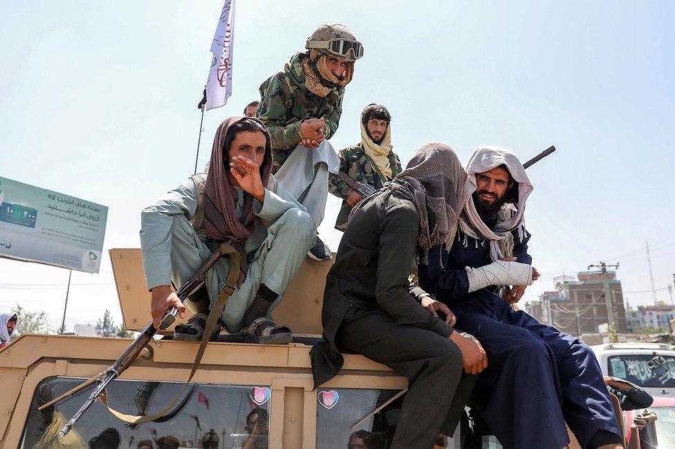 Taliban fighters are seen on the back of a vehicle in Kabul, Afghanistan, 16 August 2021. Taliban co-founder Abdul Ghani Baradar, on 16 August 2021,