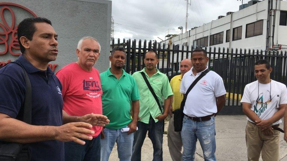 Men outside Alimentos Polar factory