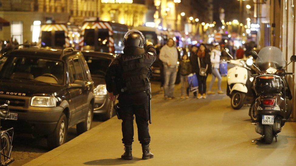 French Police officers react after a shooting in which a police officer was shot dead along with the gunman in an attack near the Champs Elysees in Paris, France, 20 April 2017