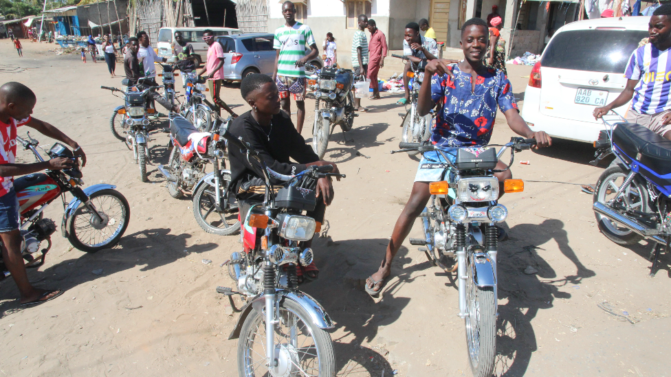 A group of local mota taxi riders in Pemba, Mozambique - May 2022