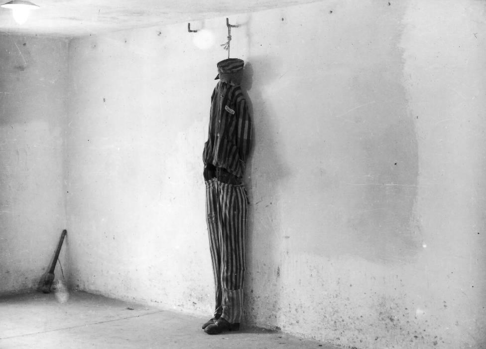 In a photograph taken shortly after the liberation of Buchenwald, a mannequin is used to show how prisoners were hanged in the crematorium cellar