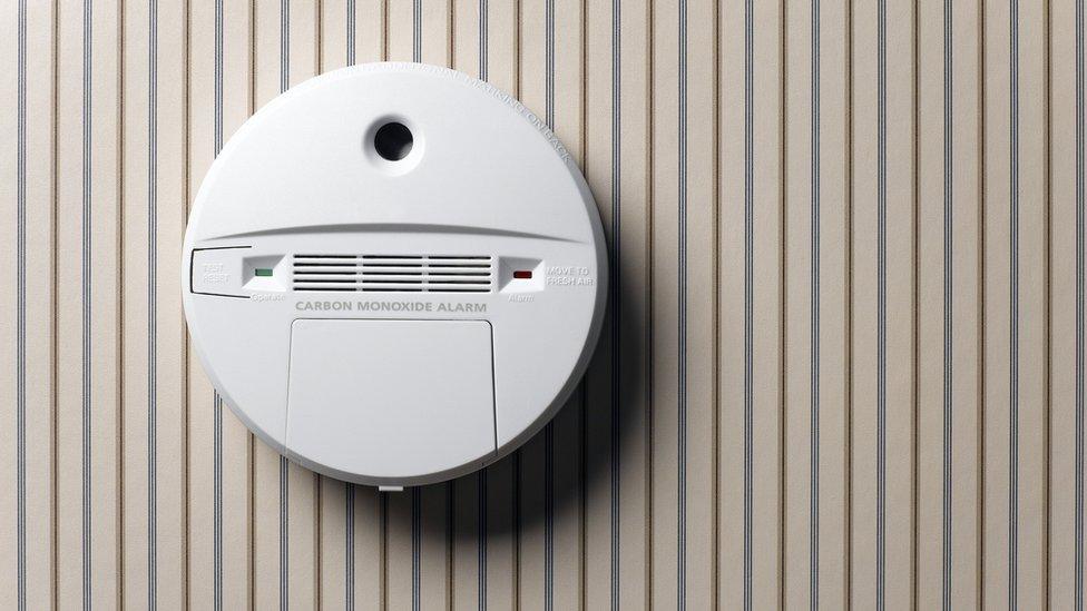 Carbon monoxide alarm mounted on a wall