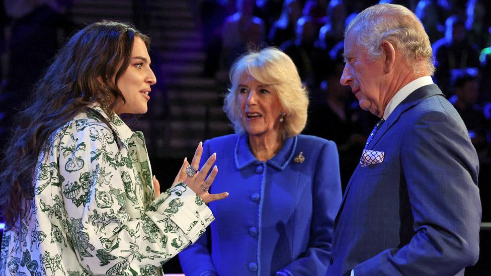 King Charles III and the Queen Consort meets the UK's Eurovision Song contestant Mae Muller, during a visit to the M and S Bank Arena, the host venue of this year's Eurovision Song Contest, to reveal this year's staging and tour the arena, meeting the creative team and presenters