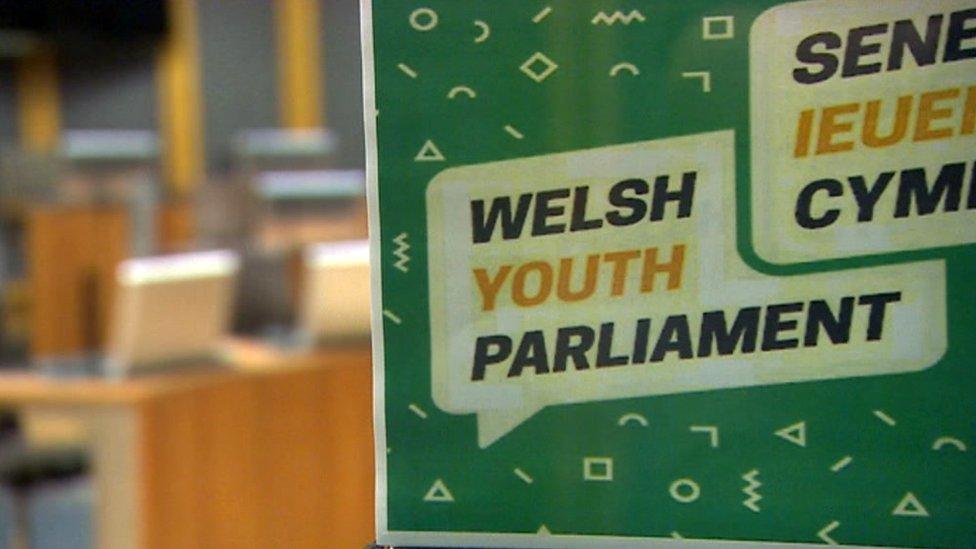 Welsh Youth Parliament sign in Senedd chamber