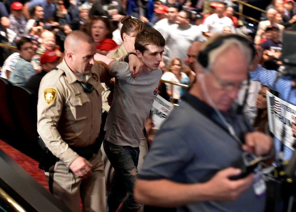 Police make arrest at Donald Trump's campaign rally at the Treasure Island Hotel Casino in Las Vegas, Nevada, 18 June