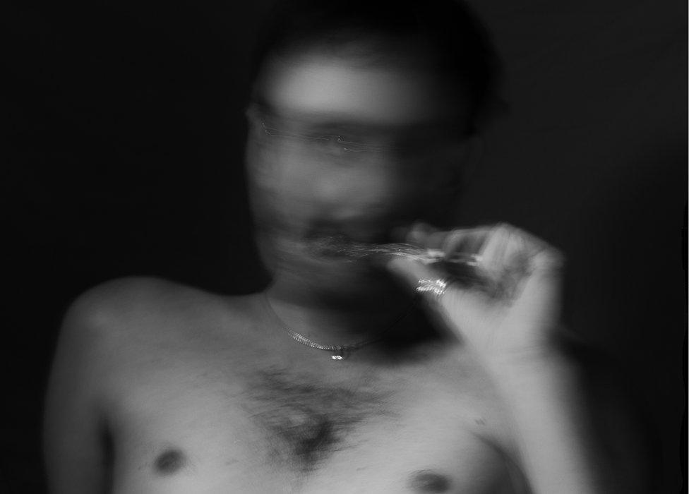 blurred image of man vaping