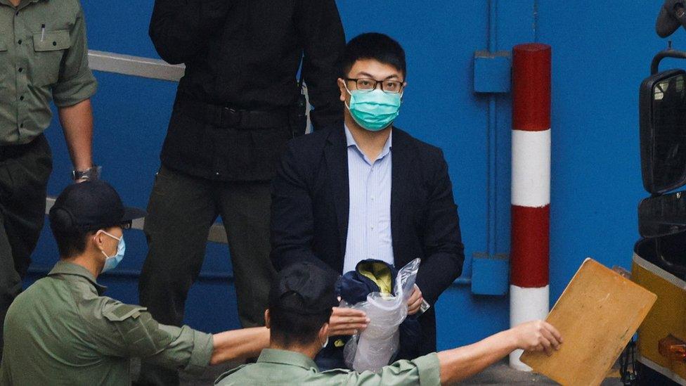 Pro-democracy activist Ben Chung Kam-lun walks to a prison van to head to court with other activists, over a national security law charge, in Hong Kong, China March 4, 2021. REUTERS/Tyrone Siu