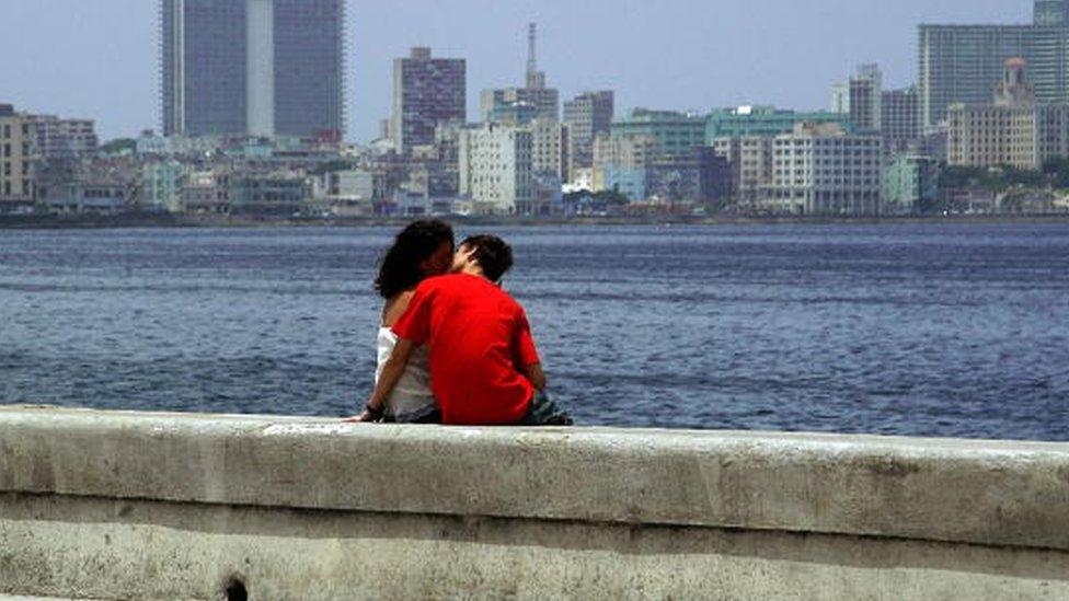 A couple kisses at Havana's seafront on August 3rd, 2006.