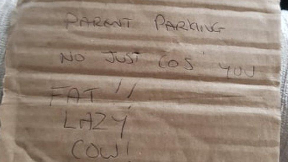 Parking note reading "parent parking, not just cos you're fat"