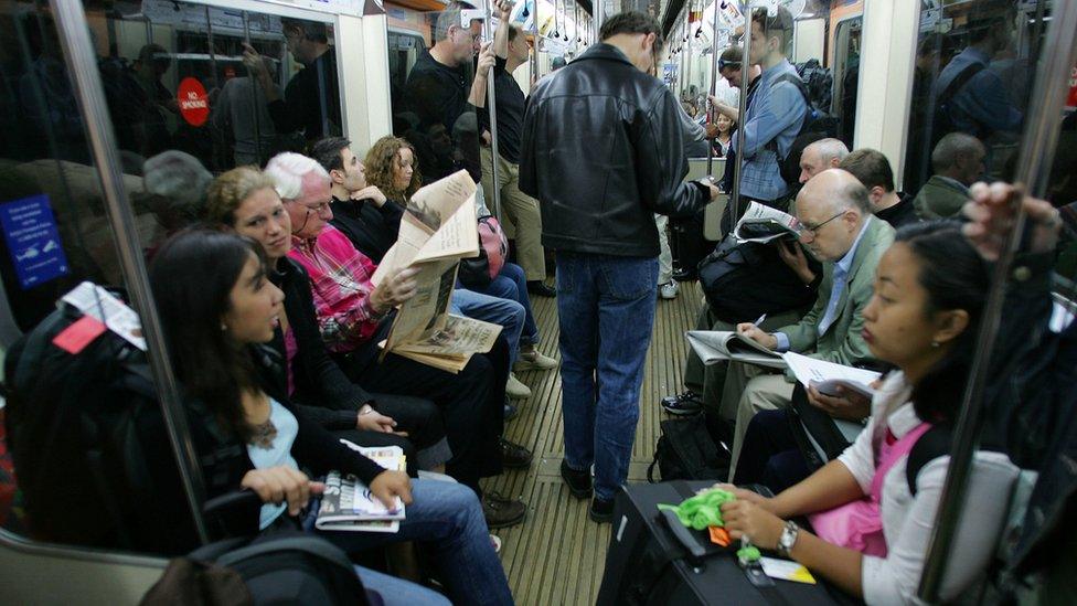 Commuters on a tube train