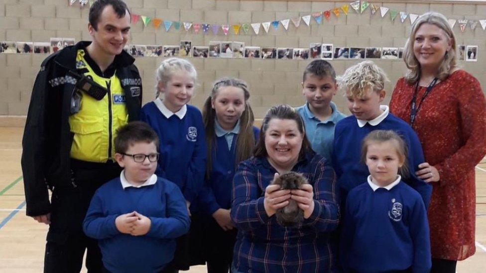 Children from Southwick Primary School with a hedgehog