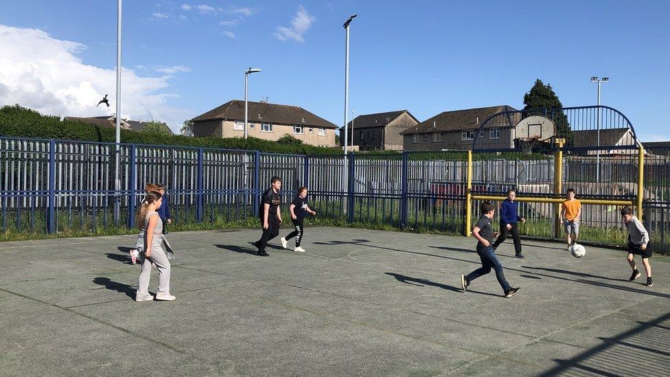 kids having a kick about in the KPC play area