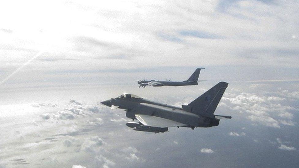 a Eurofighter Typhoon (near) and a Russian Bear F aircraft (far), one of two Russian aircraft the Typhoon has been sent to intercept off the Scottish Coast from Leuchars Station