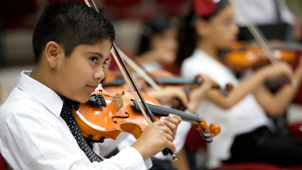 boy playing violin