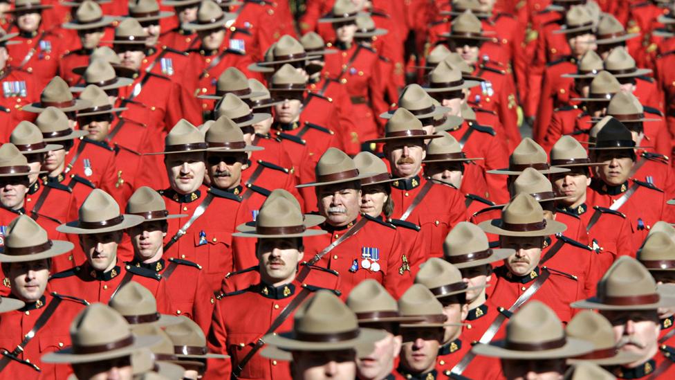 Thousands of Royal Canadian Mounted Police (RCMP) officers march through the streets of Edmonton, Canada Thursday March 10, 2005