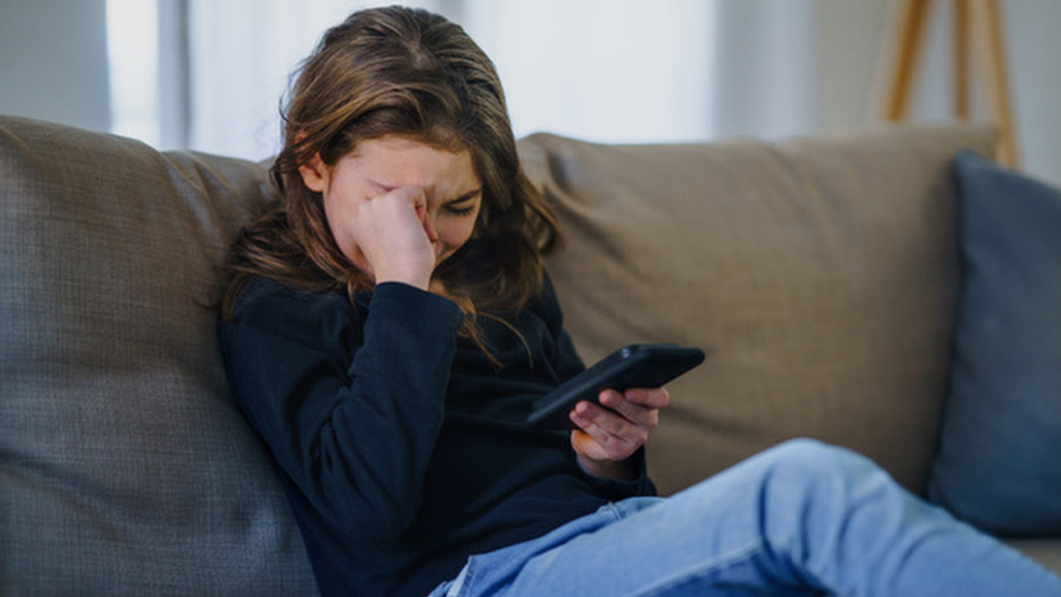 Girl upset with phone