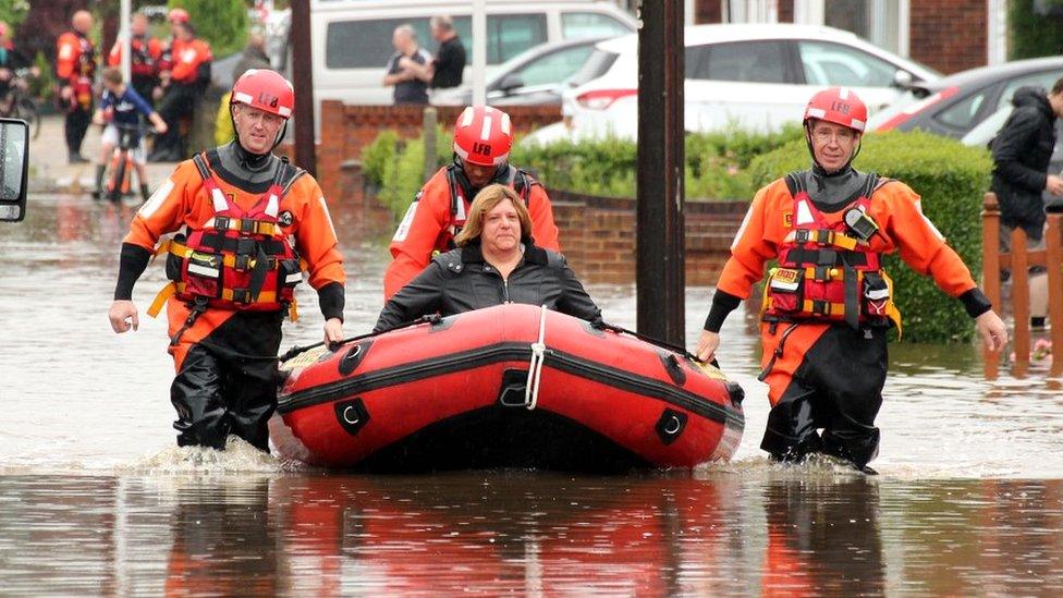 Fire crews rescuing Barking residents using boats