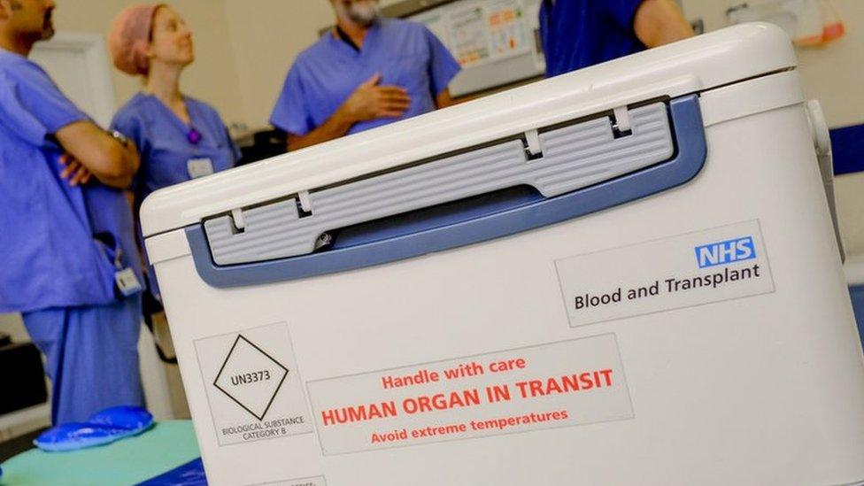 Box with organ for transplant reading "handle with care: human organ in transit"