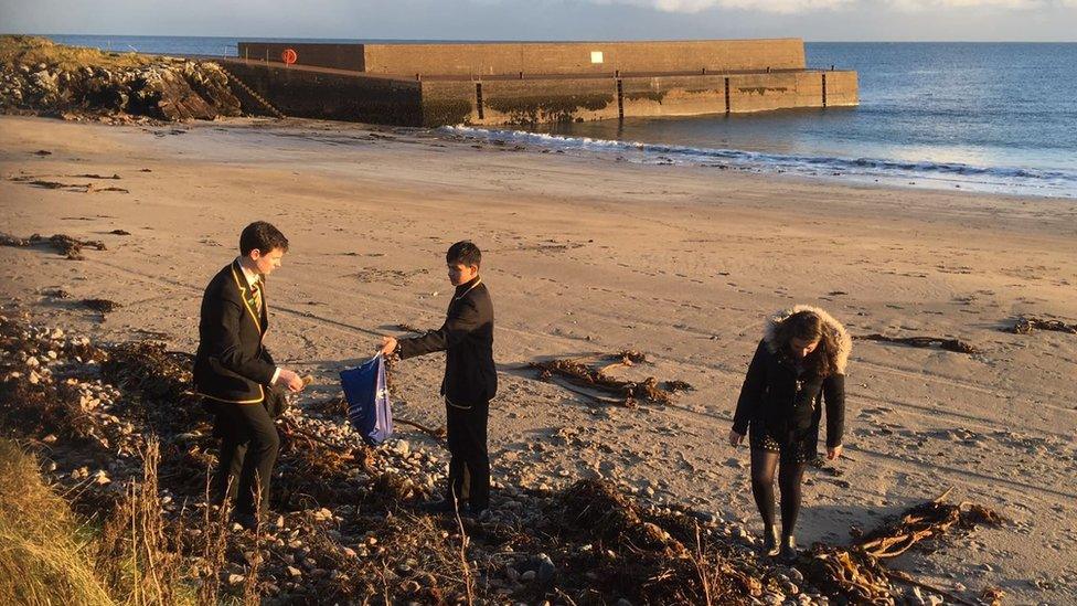 Pupils gathering stones