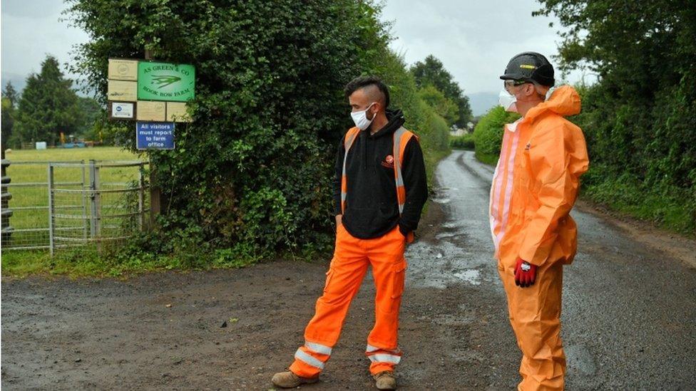 Contractors outside the farm