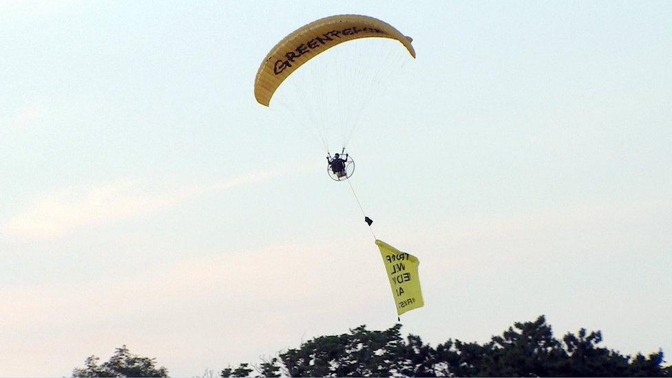 paraglider with banner near Turnberry