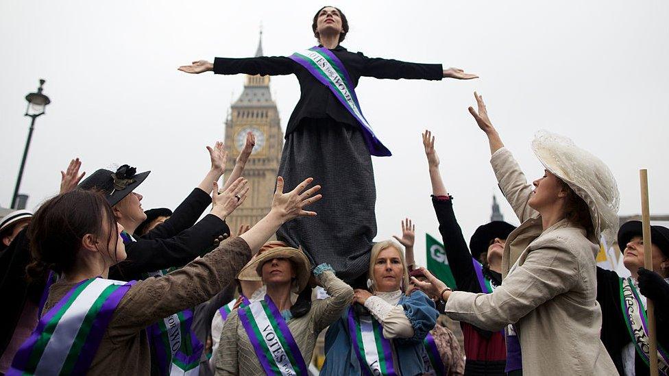 Protesters dresses as Suffragettes