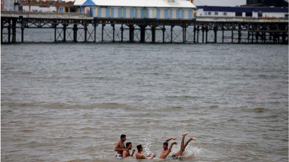 Young men in sea off Blackpool