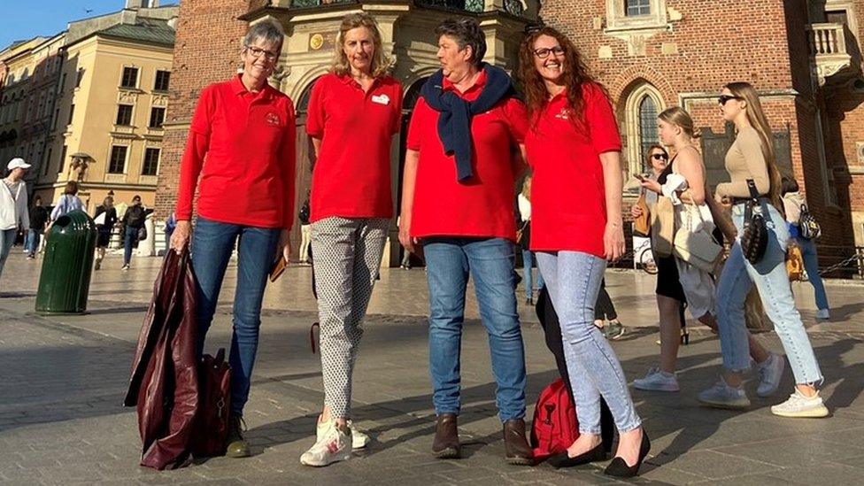 Four women in the middle of Krakow, Poland