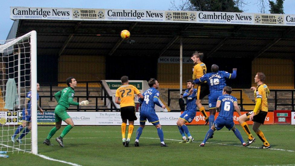 Cambridge United playing AFC Wimbledon at the Abbey Stadium at League Two