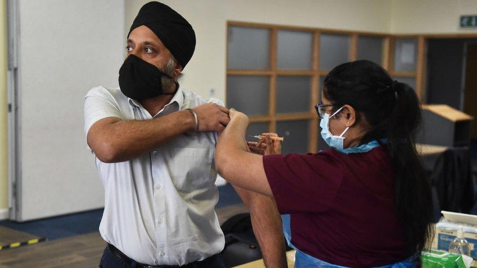 Someone from Stoke's City Mosque receives a vaccination against Covid-19 on 26 February 2021