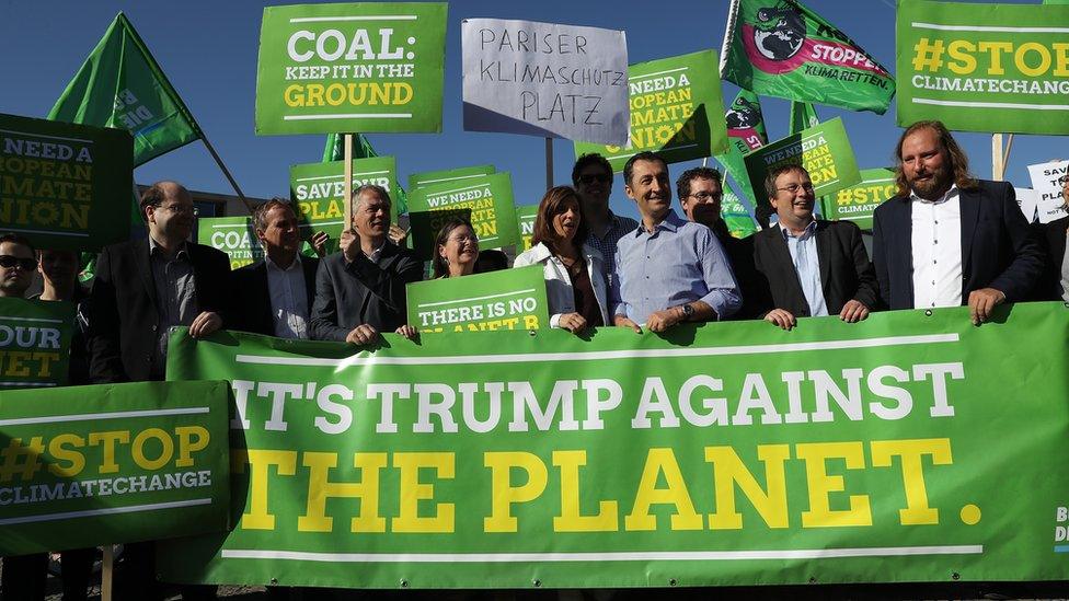 Members of the German Green Party protest outside the U.S. Embassy in Berlin