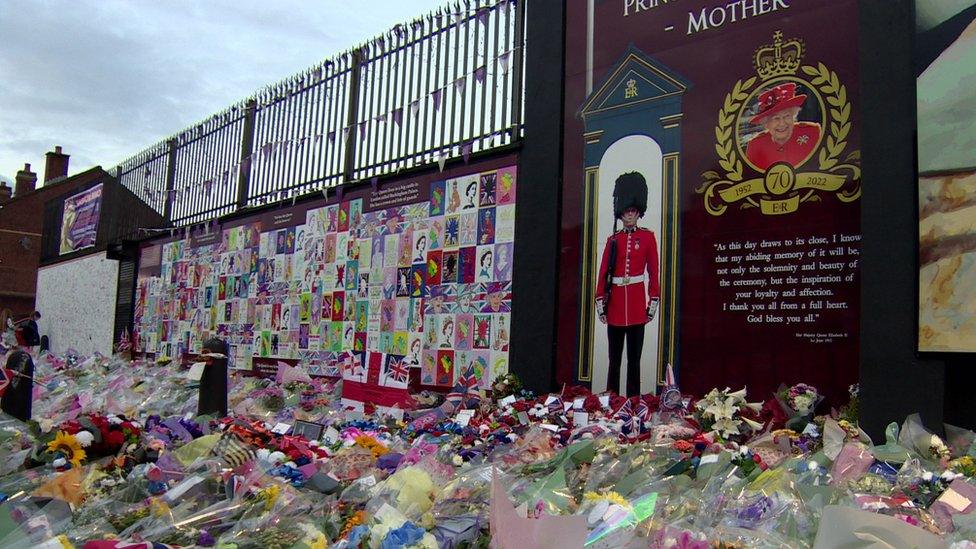 Flowers laid at mural of the Queen on Shankill Road