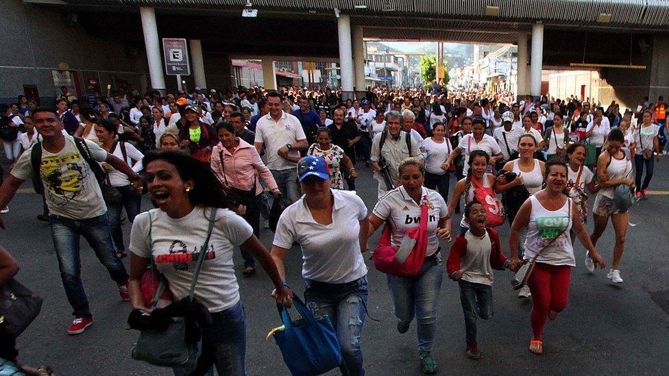 Venezuelans cross from San Antonio del Tachira, Venezuela to Cucuta, Colombia on 10 July