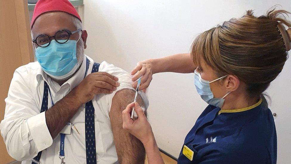 Imam Monawar Hussain, our Muslim chaplain, receives his COVID-19 vaccination from Sam Foster, Chief Nursing Officer