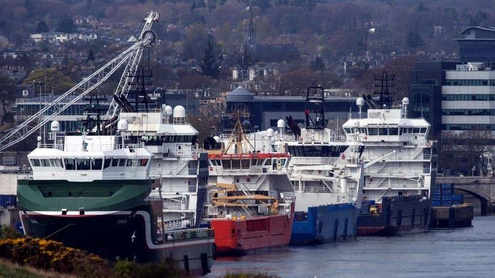 A row of four large ships harboured in Aberdeen