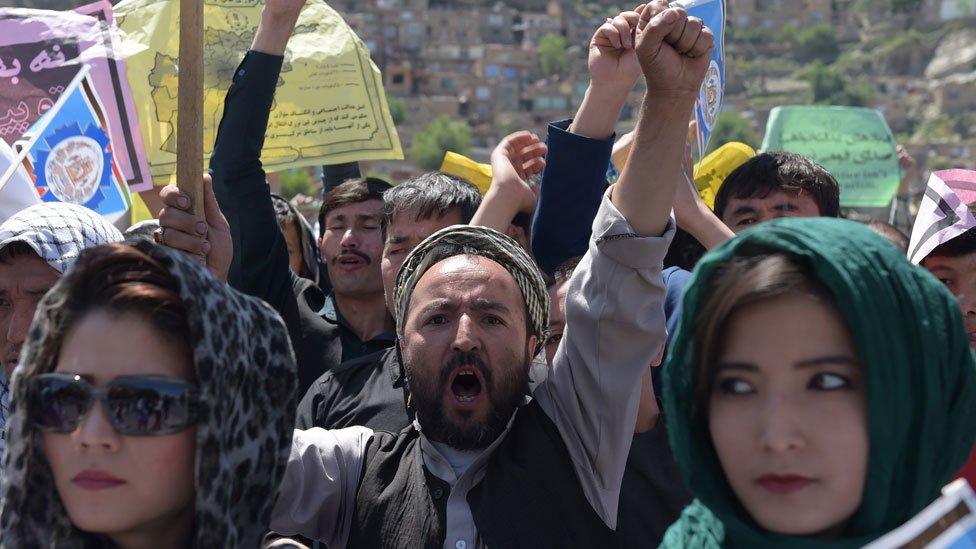 Afghan Hazara protesters chant anti-government slogans during a demonstration in Kabul