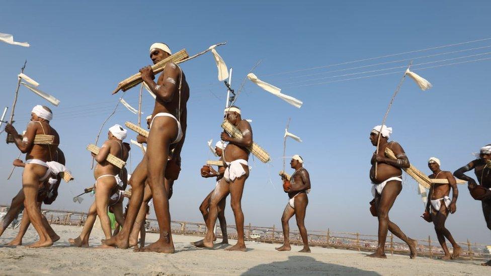 Pilgrims walking to take a dip