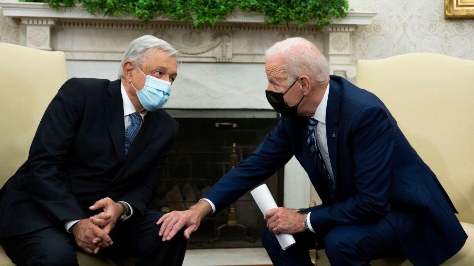 President Joe Biden (R) meets with Mexican President Andres Manuel Lopez Obrador (L) in the Oval Office of the White House