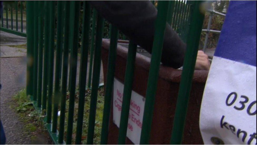 Bin for cigarette ends at school entrance