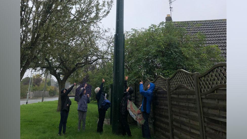 Residents beside mast, Gunsthorpe, Peterborough