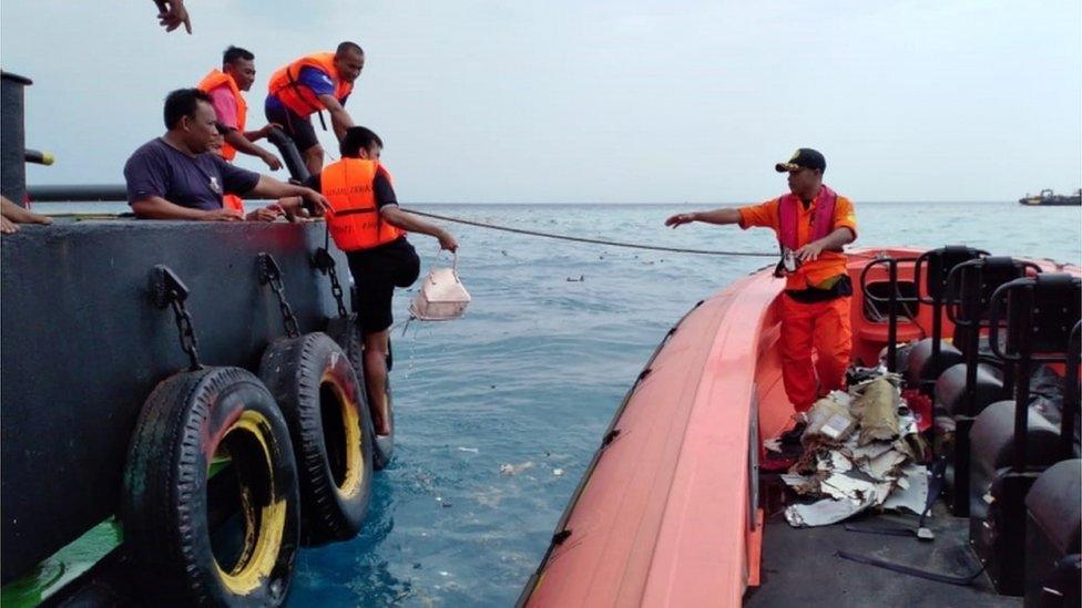 Rescuer workers recovered debris from the crash site