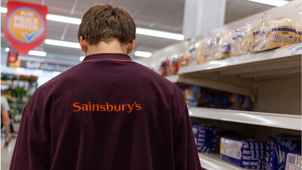 Sainsbury's worker in bread aisle