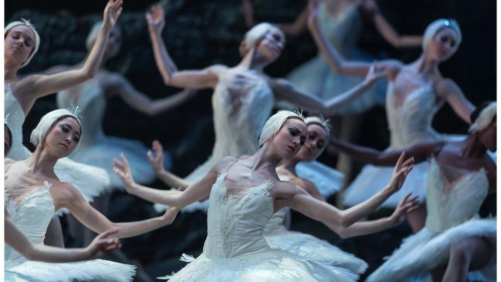 The ballet corps in ENO's Swan Lake dance in white