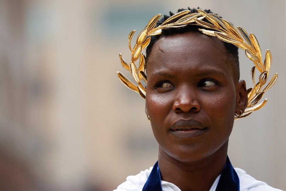 Diana Kipyogei of Kenya wears a gilded crown.