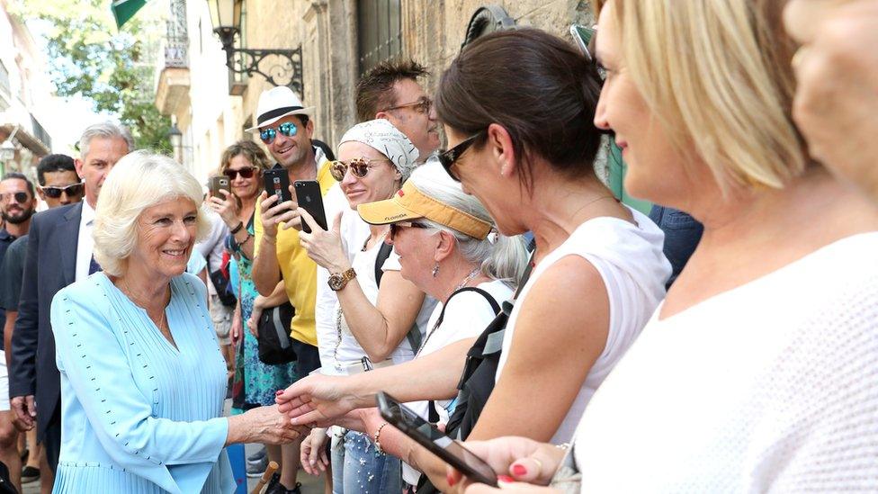 Duchess of Cornwall greets well-wishers during a guided tour of Old Havana