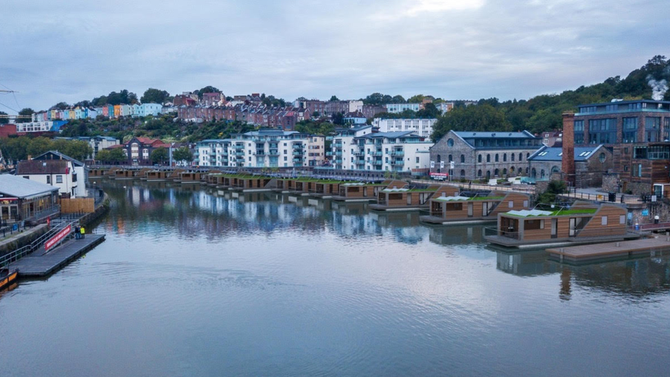 Looking down on Bristol harbour with an artists impression of what the floating homes would look like lined up on the waters edge opposite the SS Great Britain