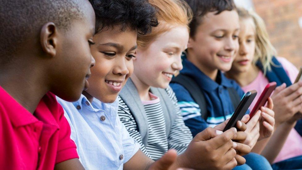 Children using smartphones