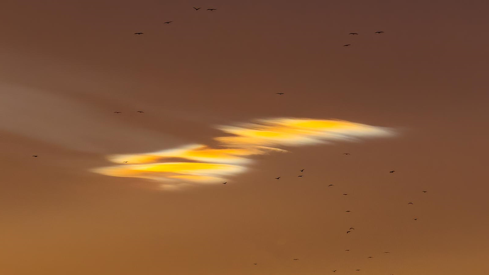 Iridescent colours in cloud